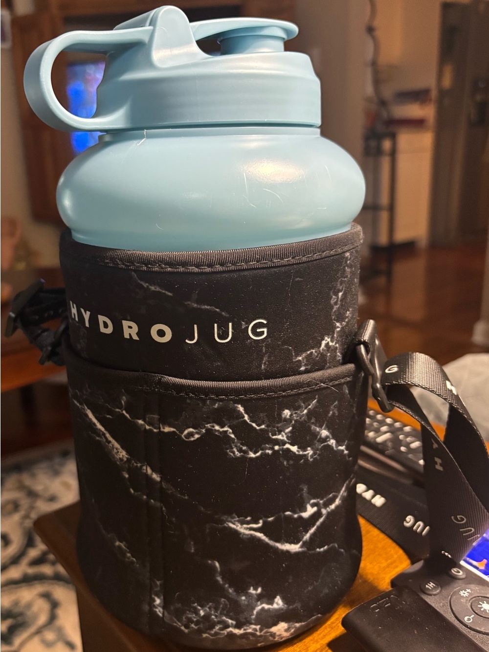 HydroJug Light Blue Bottle with Black Marble Sleeve